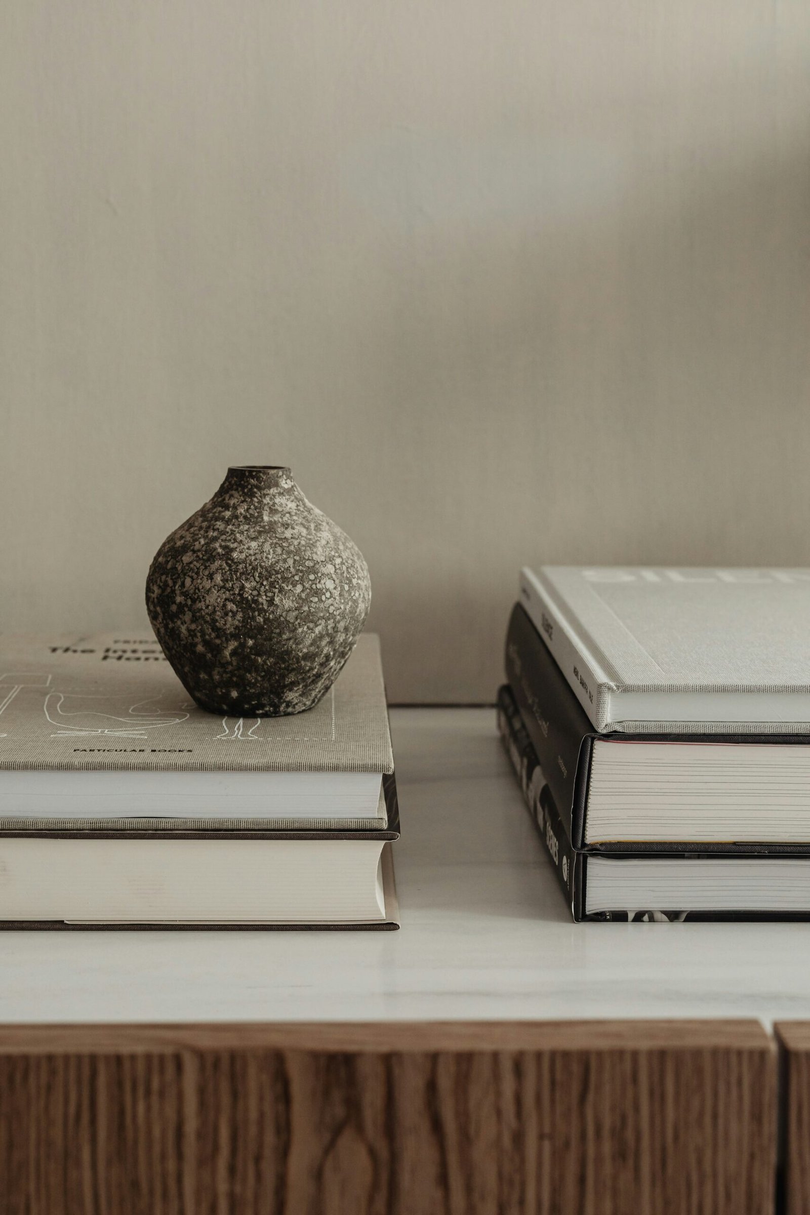 Neutral Decor Pieces That Work Year-Round 10 neutral vase and books