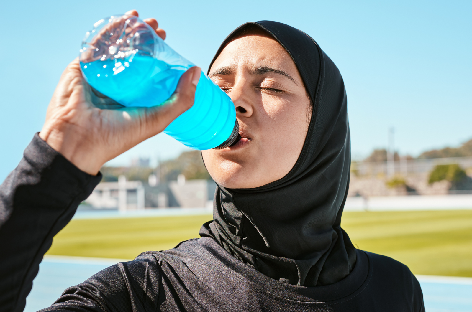 woman drinking electrolyte