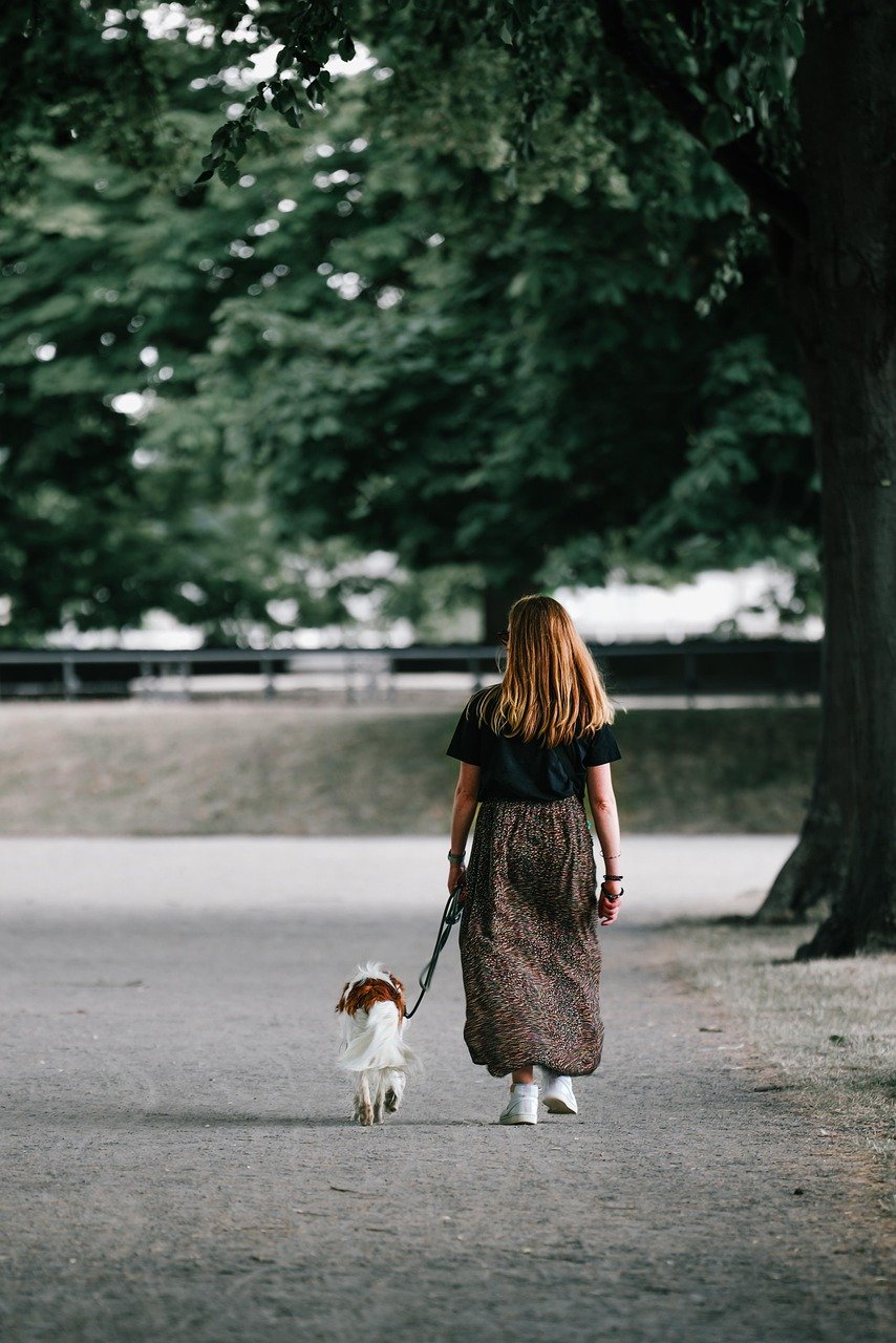 woman walking with her dog
