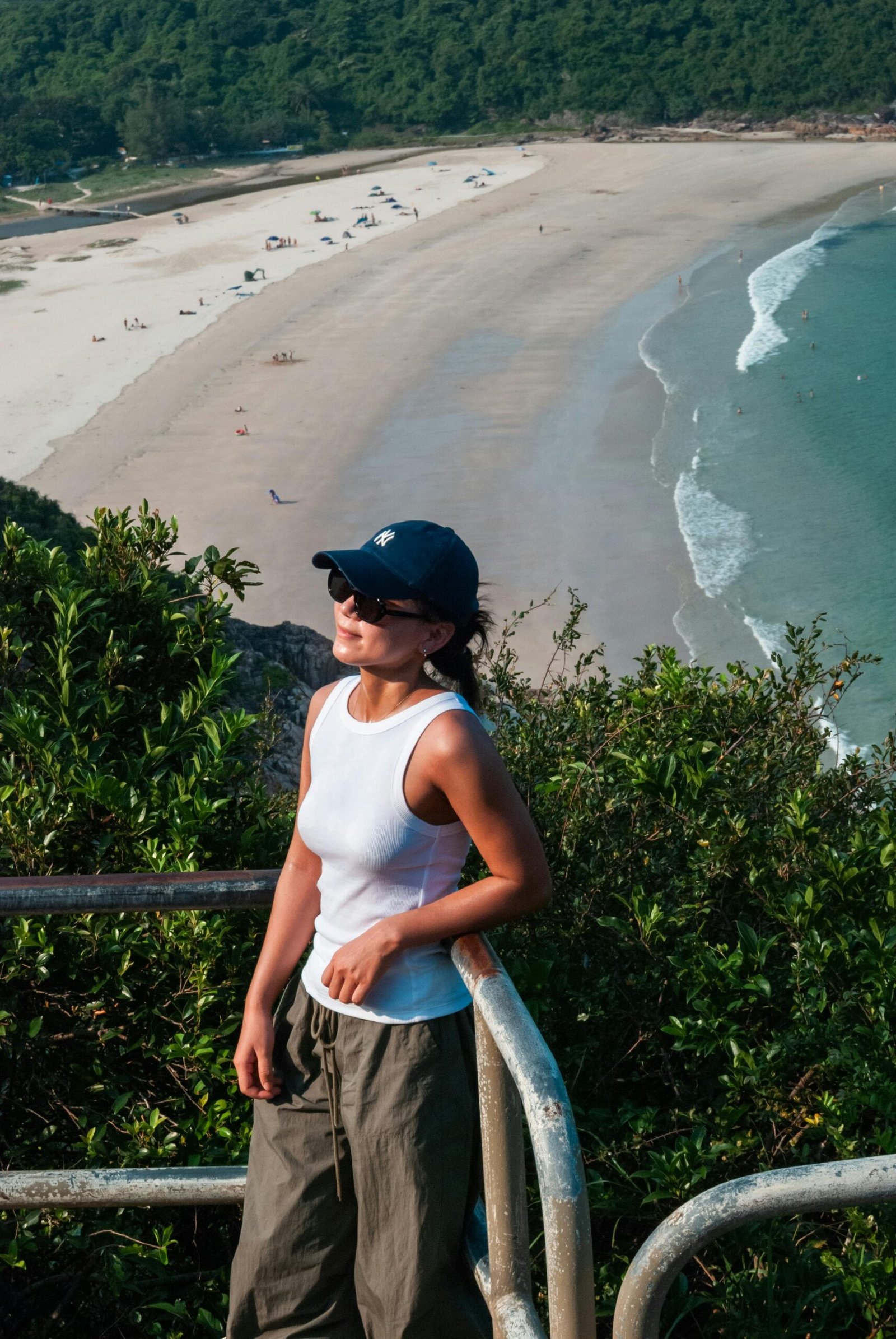 Travel Outfit Essentials: Look Put Together Without Losing Your Mind 12 woman in the beach