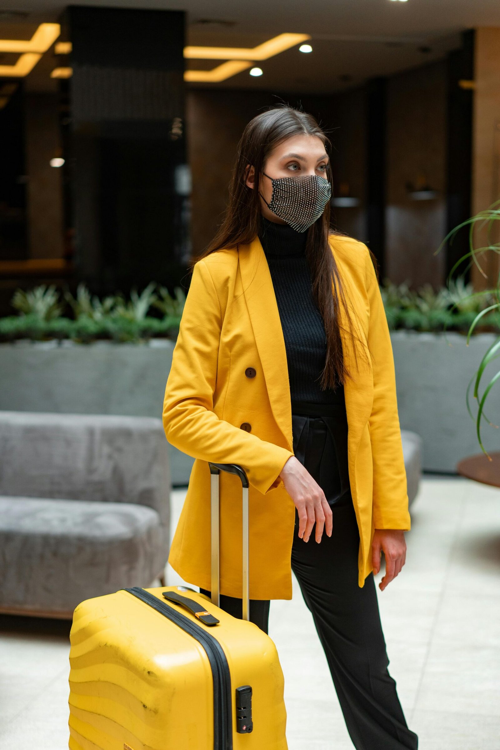 Travel Outfit Essentials: Look Put Together Without Losing Your Mind 4 woman wearing yellow blazer
