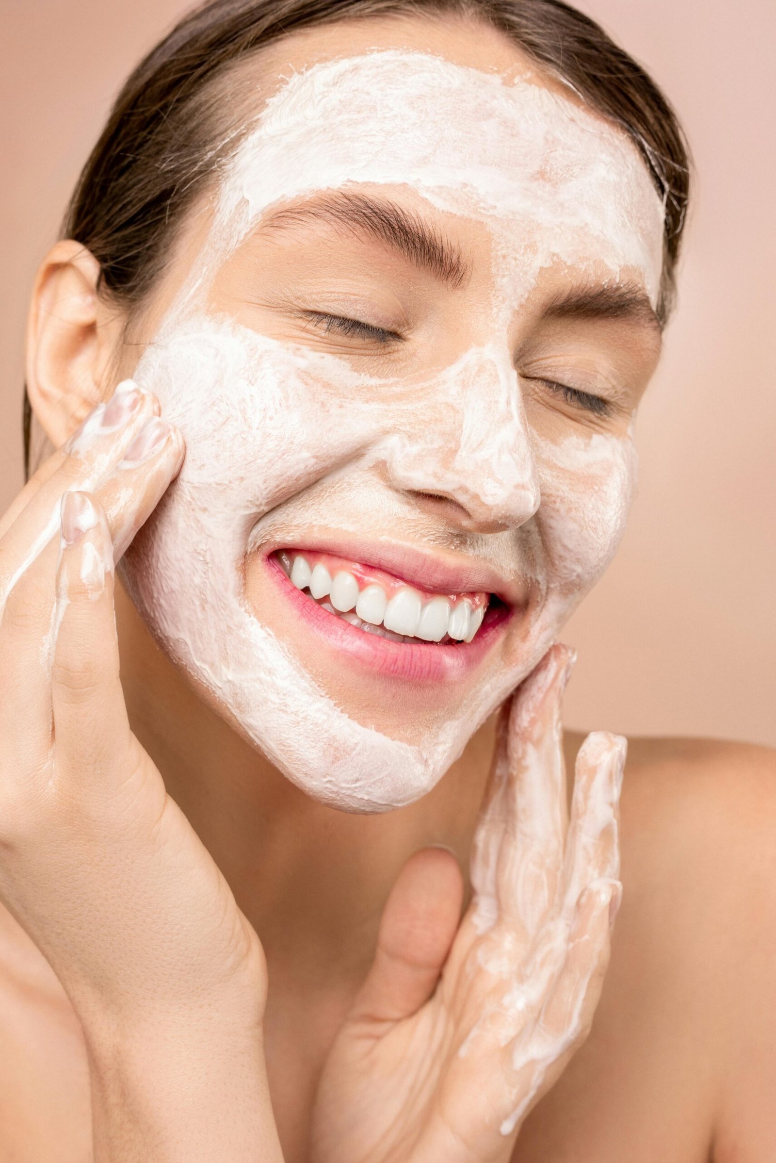 woman applying her gentle cleanser