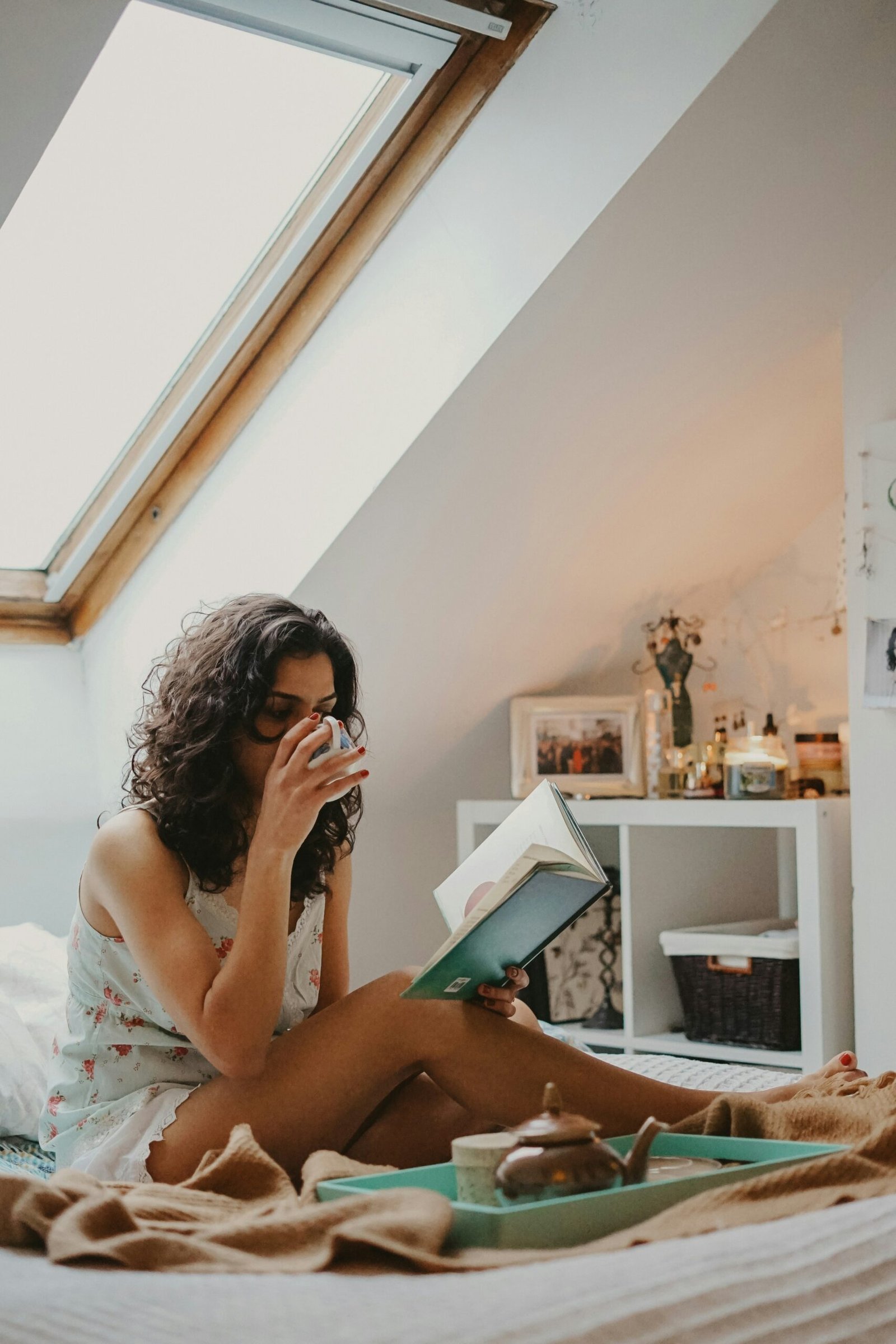 Self-Care Essentials for Busy Women 2 woman sipping coffee while reading a book
