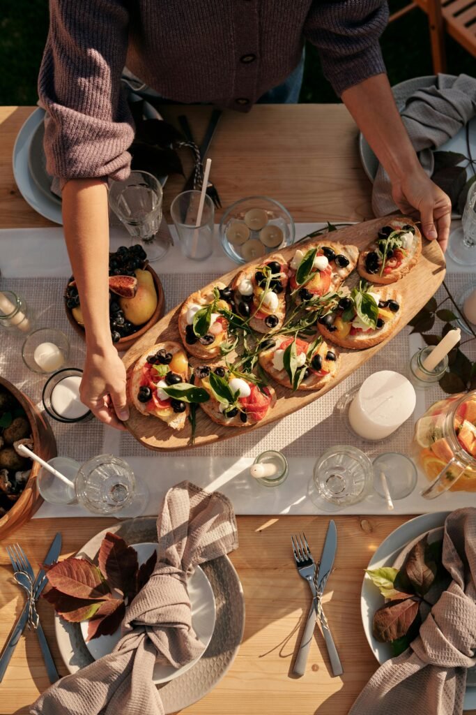 woman serving charcuterie for hosting