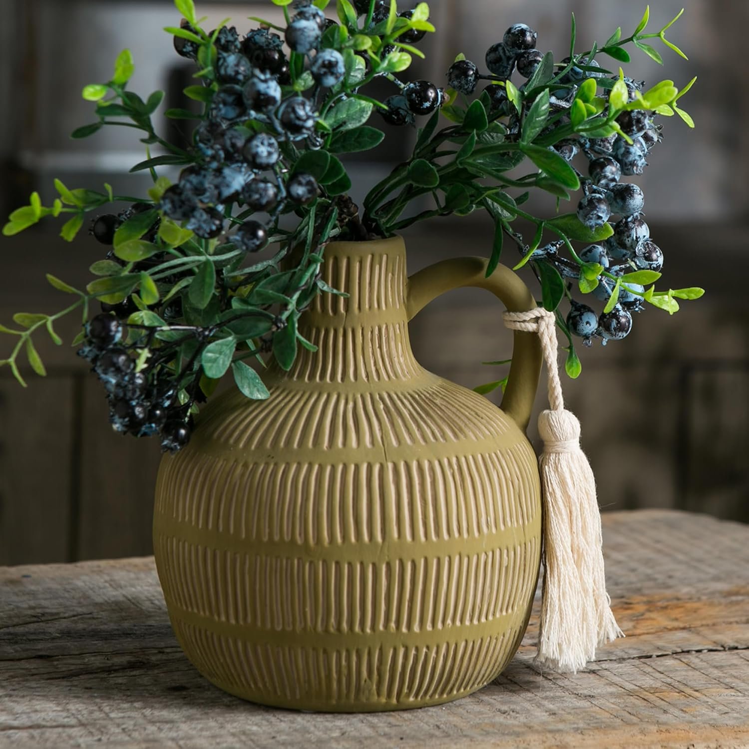 Coffee Table Styling Pieces That Make Your Living Room Look Expensive 74 2191 Green Vase w Handle Tassel w Grey Yellow Stripes